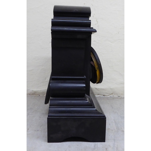 86 - A late Victorian slate cased mantel clock, on a plinth; the movement faced by a Roman dial  18