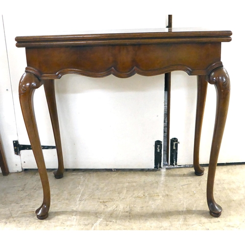 92 - An early 20thC mahogany card table, the foldover top raised on cabriole legs  29