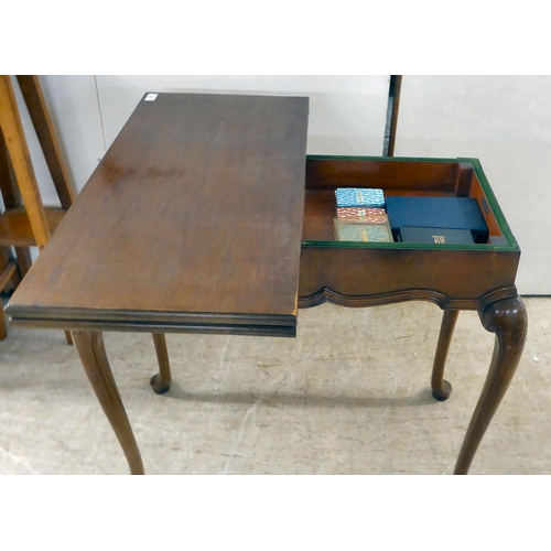 92 - An early 20thC mahogany card table, the foldover top raised on cabriole legs  29