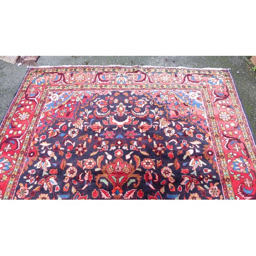 82 - A Persian carpet, decorated with floral and foliage designs, on a multi-coloured ground  94