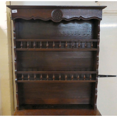 100 - An early 20thC oak two-part cottage dresser with two open shelves, over two panelled cupboard doors,... 