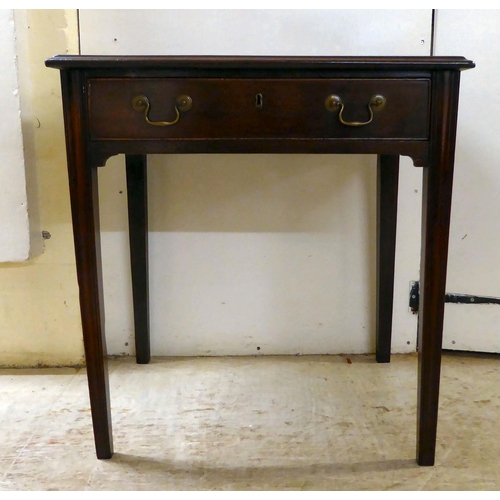 105 - A 19thC mahogany single drawer side table, raised on square, tapered legs  27