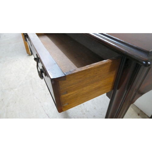 105 - A 19thC mahogany single drawer side table, raised on square, tapered legs  27