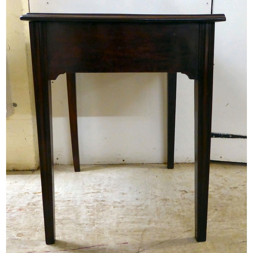 105 - A 19thC mahogany single drawer side table, raised on square, tapered legs  27