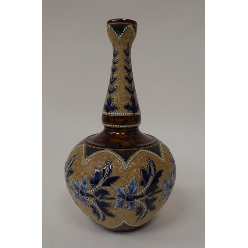 116 - A late Victorian Doulton Lambeth stoneware bottle vase, decorated in tones of blue, green and brown ... 