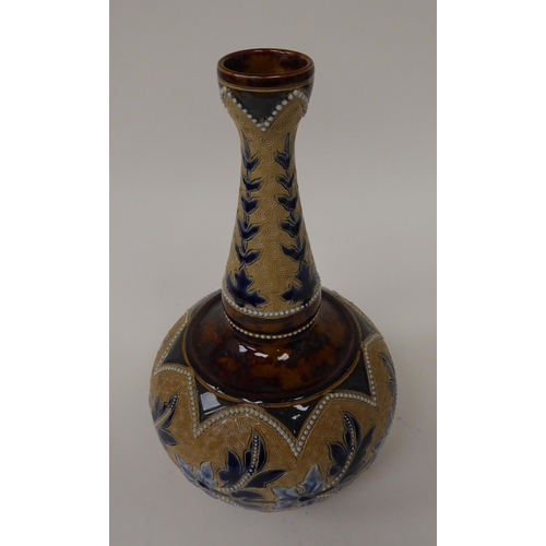 116 - A late Victorian Doulton Lambeth stoneware bottle vase, decorated in tones of blue, green and brown ... 