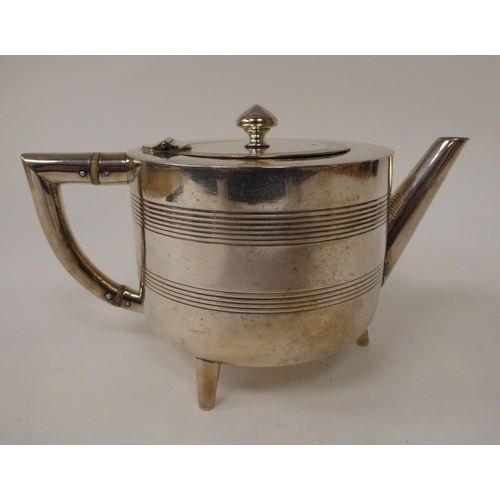 12 - A three piece silver plated tea set, circa 1880, designed by Christopher Dresser of round basin desi... 