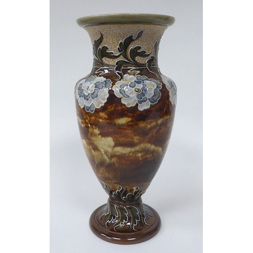 121 - A late Victorian Doulton Lambeth stoneware vase of ovoid pedestal form, decorated in colours with st... 