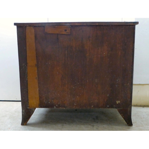 122 - A George III mahogany bachelor's chest with a brushing slide, over three drawers, raised on bracket ... 