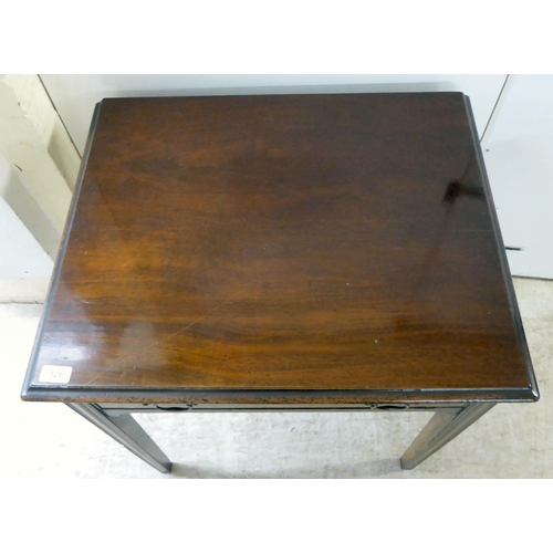 125 - A George III mahogany single drawer side table, raised on square legs  27