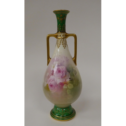 129 - A Royal Doulton china pedestal ovoid shape, twin handled vase, decorated with roses and other flora ... 