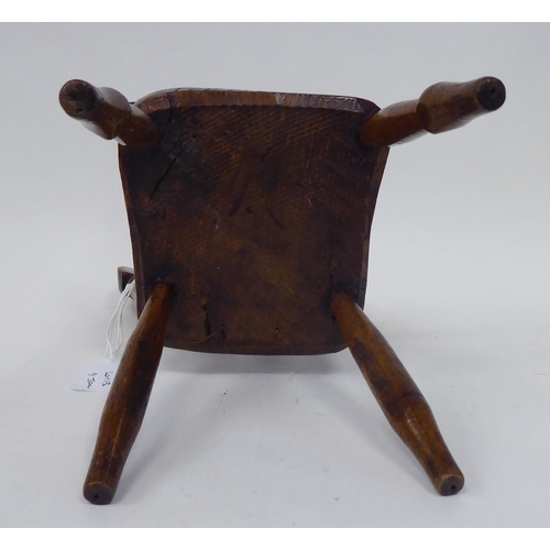 13 - An antique finished, mahogany miniature crib, fashioned as a planter, on a rocker base  18