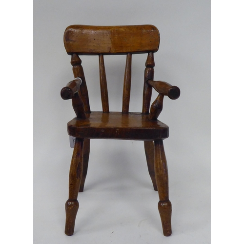 13 - An antique finished, mahogany miniature crib, fashioned as a planter, on a rocker base  18