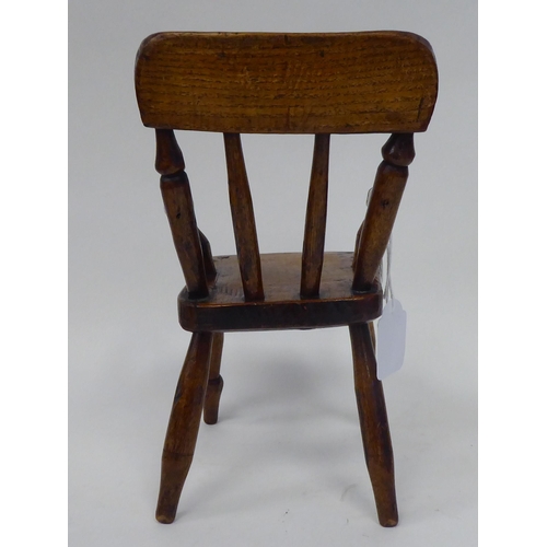 13 - An antique finished, mahogany miniature crib, fashioned as a planter, on a rocker base  18