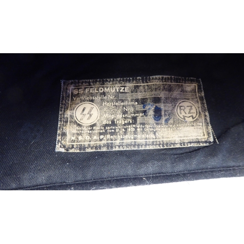 130 - A German Waffer SS tankman's side cap with an insignia and label(Please Note: this lot is subject to... 