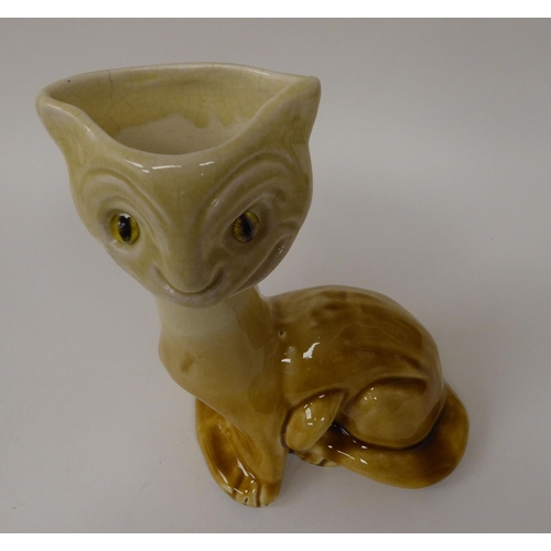 14 - An early JRM & Co (JP Mally) china novelty vase, fashioned as a seated cat with glass eyes ... 