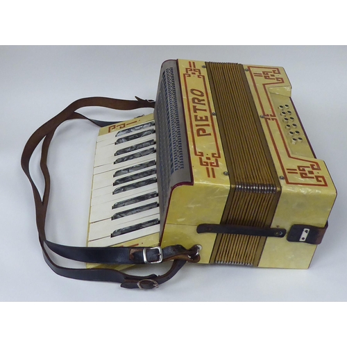 18 - A Pietra marbelised piano accordion, in a dedicated carrying case