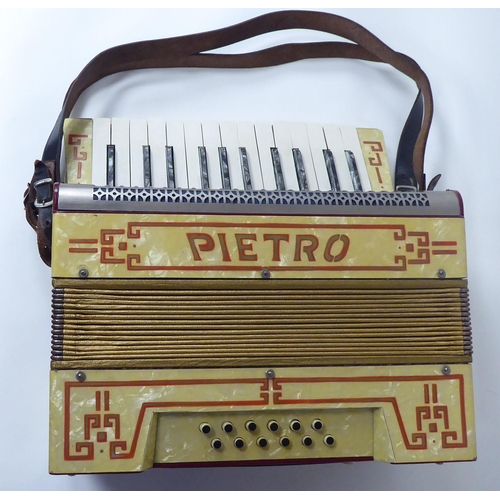 18 - A Pietra marbelised piano accordion, in a dedicated carrying case