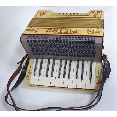 18 - A Pietra marbelised piano accordion, in a dedicated carrying case