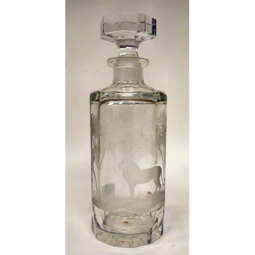 197 - A modern cut crystal, shouldered, cylindrical decanter and stopper, engraved with a study of a stand... 