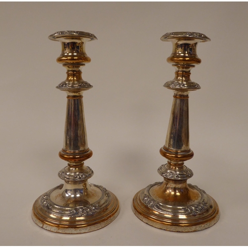 199 - A pair of mid Victorian electroplated candlesticks with knopped stems and applied ornament  8.5... 