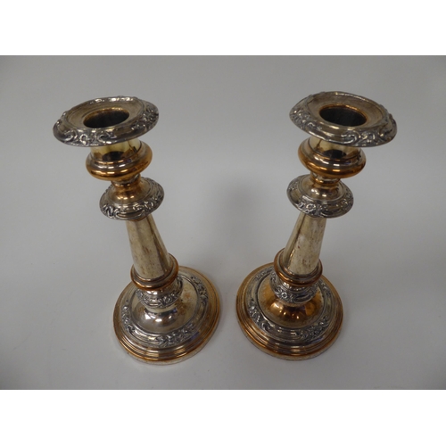 199 - A pair of mid Victorian electroplated candlesticks with knopped stems and applied ornament  8.5... 