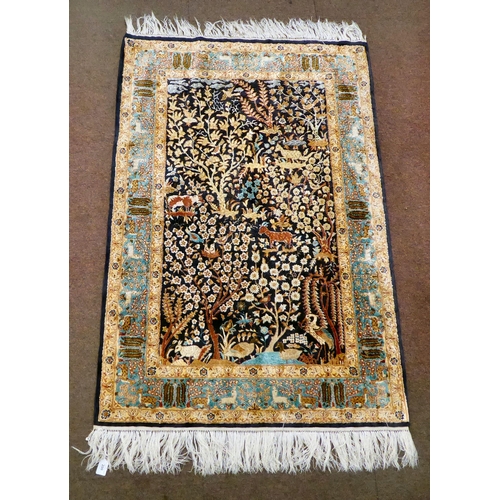 200 - A modern Persian inspired part silk rug, decorated in colours with animals, birds and floral designs... 