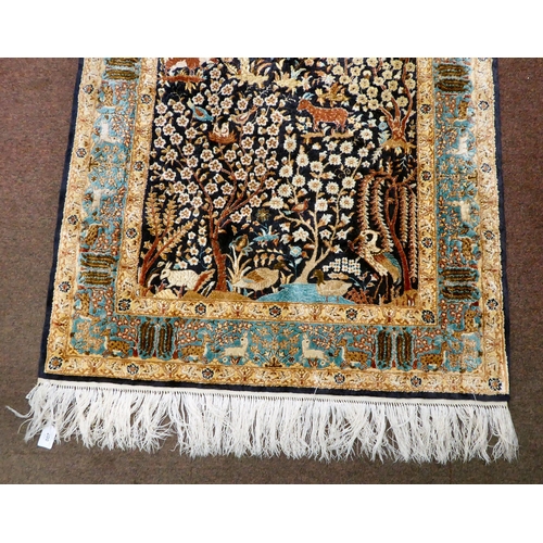 200 - A modern Persian inspired part silk rug, decorated in colours with animals, birds and floral designs... 