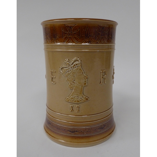 201 - A Doulton two tone brown stoneware mug, decorated to celebrate the Coronation of Queen Elizabeth in ... 