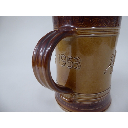 201 - A Doulton two tone brown stoneware mug, decorated to celebrate the Coronation of Queen Elizabeth in ... 