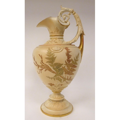 202 - A Royal Worcester blush ivory glazed, moulded and part gilded china ewer of ovoid form with a foliat... 