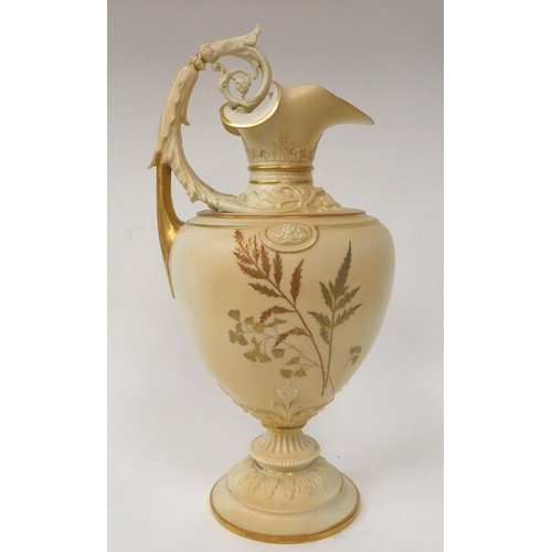 202 - A Royal Worcester blush ivory glazed, moulded and part gilded china ewer of ovoid form with a foliat... 