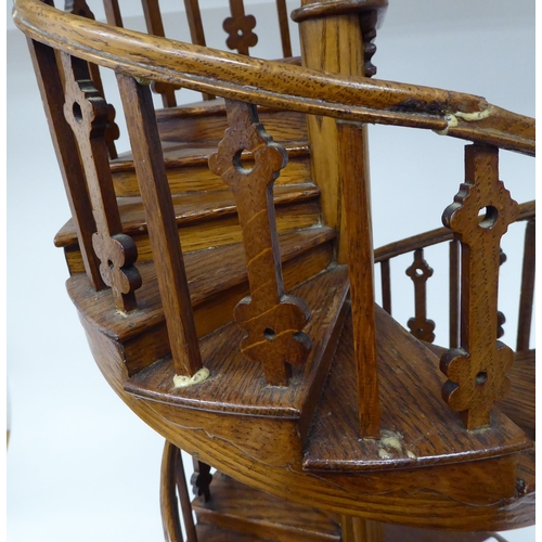 205 - A scratch built model in oak, a study of a double spiral staircase, on a circular plinth  26