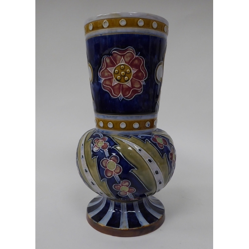 206 - An early 20thC Doulton Lambeth stoneware vase, decorated in colours with red roses and other designs... 