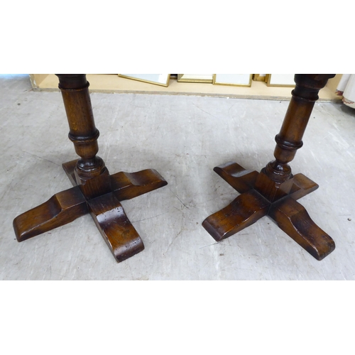 210 - A pair of (probably) Titchmarsh & Goodwin, traditional Old English style, oak pedestal wine tabl... 