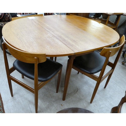 212 - A G-Plan teak drop-leaf table, raised on turned legs  29