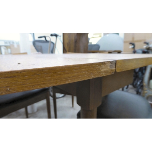 212 - A G-Plan teak drop-leaf table, raised on turned legs  29