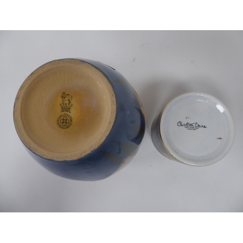 214 - A Carltonware china sugar pot with a cover and spoon, decorated in a version of the Mikado pattern, ... 