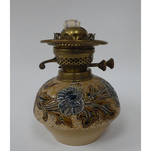 226 - A late 19thC stoneware and brass lamp with floral and foliate decoration  7.5