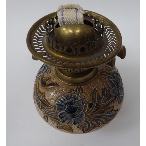 226 - A late 19thC stoneware and brass lamp with floral and foliate decoration  7.5