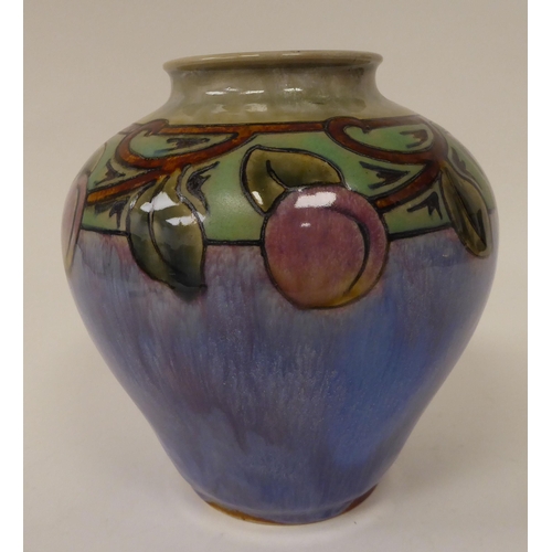 229 - A 20thC Doulton Lambeth stoneware vase of squat, bulbous form, decorated in colours with trailing so... 