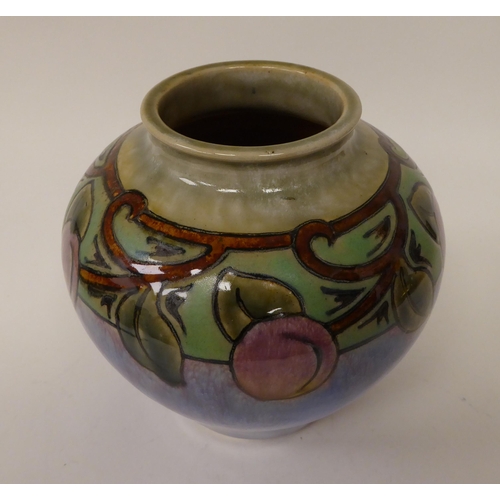 229 - A 20thC Doulton Lambeth stoneware vase of squat, bulbous form, decorated in colours with trailing so... 