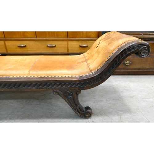 237 - A 20thC Asian hardwood framed window seat, stud upholstered in tan coloured hide, raised on splayed ... 