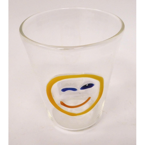 240 - A clear glass beaker, decorated in raised colours  bears an etched signature Ulessimo