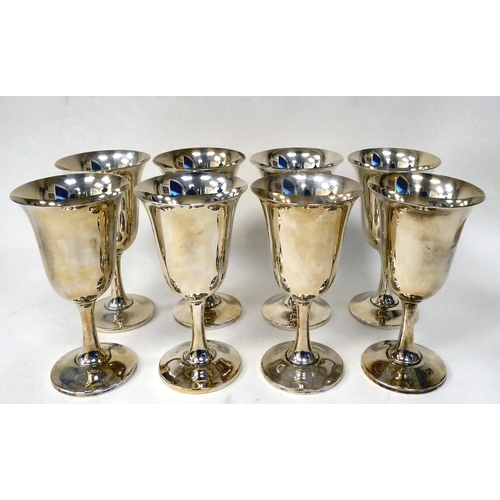 247 - A set of eight Sterling silver goblets with bell shaped bowls, on waisted stems  (combined weig... 