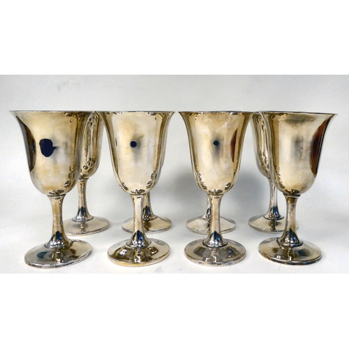 247 - A set of eight Sterling silver goblets with bell shaped bowls, on waisted stems  (combined weig... 