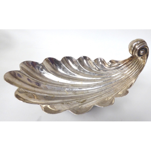 254 - A Sterling silver shell design dish, on a decoratively cast pedestal footrim  8.5