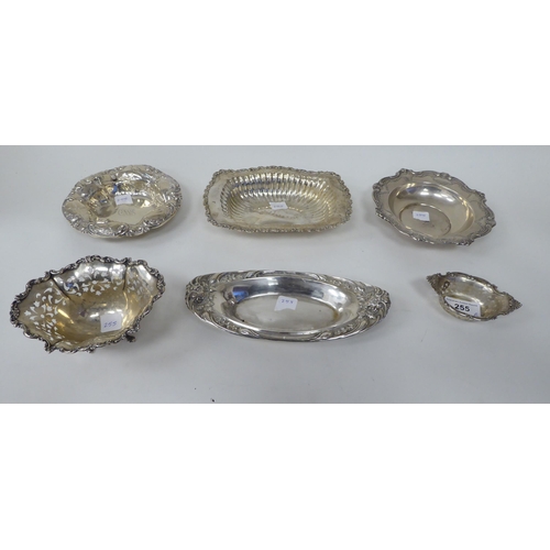 255 - Six various Sterling silver dishes, decorated with embossed and cast ornament  largest, a bowl ... 