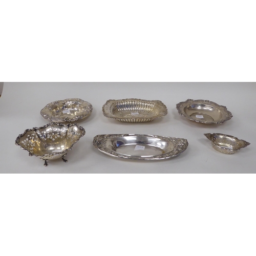 255 - Six various Sterling silver dishes, decorated with embossed and cast ornament  largest, a bowl ... 