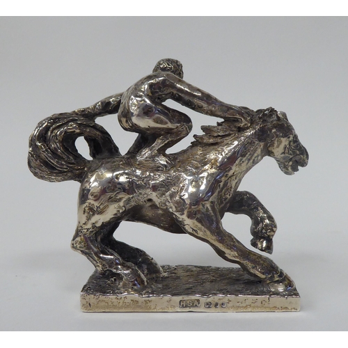 256 - A series of three, solid silver models, depicting acrobatic horsemen, each set on a rectangular plin... 